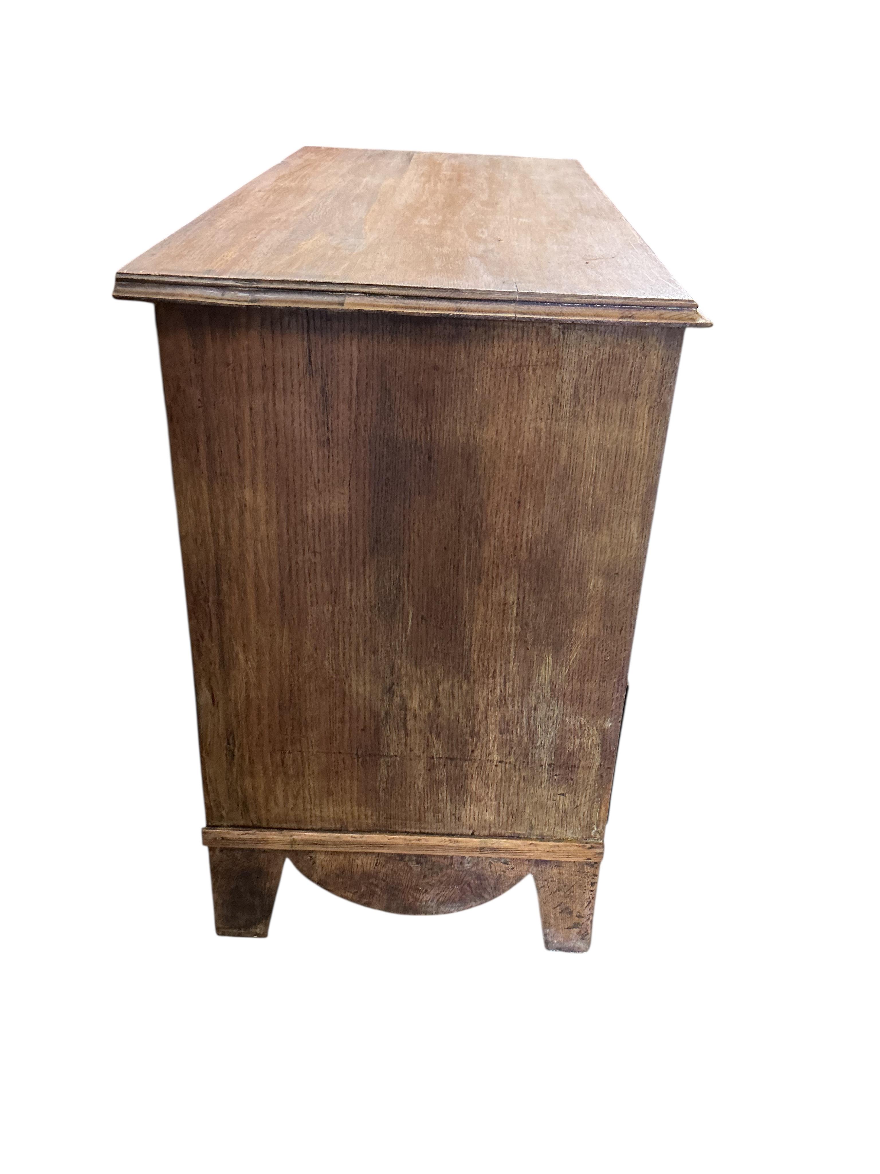 An early 20th century oak three drawer chest, width 106cm, depth 49cm, height 78cm